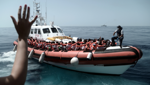 Aquarius is currently in the process of transferring 400 persons to two Italian Navy ships, at the request of the Italian MRCC. Aquarius was instructed by Maritime Rescue Coordination Centre in Rome to sail to Valencia to disembark the remaining 229 people.
 
While this appears to be a quick fix to the current political standoff, this should not set a precedent for future disembarkations. Rescued people should be disembarked in the nearest safe port available.