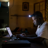 Jean Liyolongo, Head of Monga Intervention, works late into the night at the MSF base, Monga, in Bas-Uele Province, Democratic Republic of Congo.